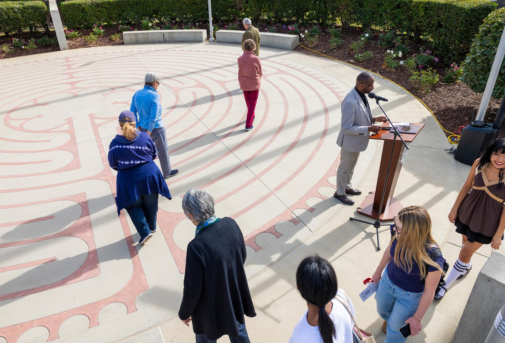 Event attendees walk the Labyrinth at Memorial Chapel as Rev. Dr. Darrell Wesley of Redlands First United Methodist Church delivers a reflection on the teachings of Rev. Dr. Martin Luther King Jr. 